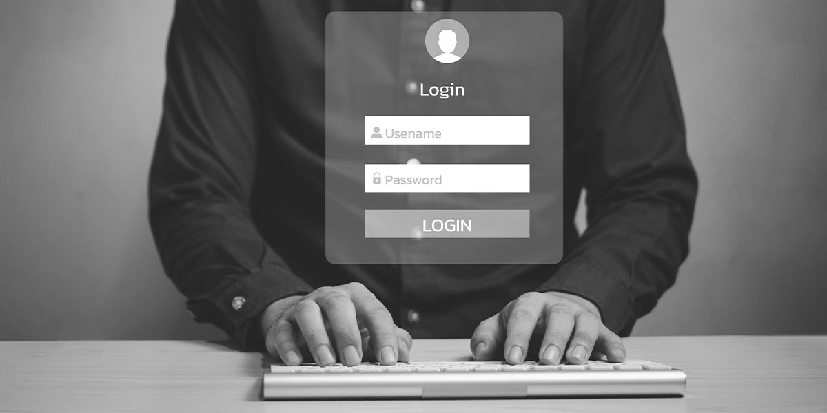 Employee entering credentials into a login prompt.