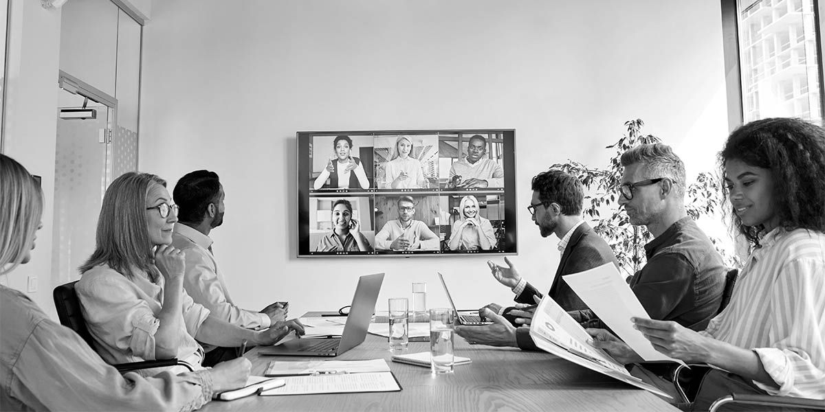 A team hosting a video call with corporate clients.